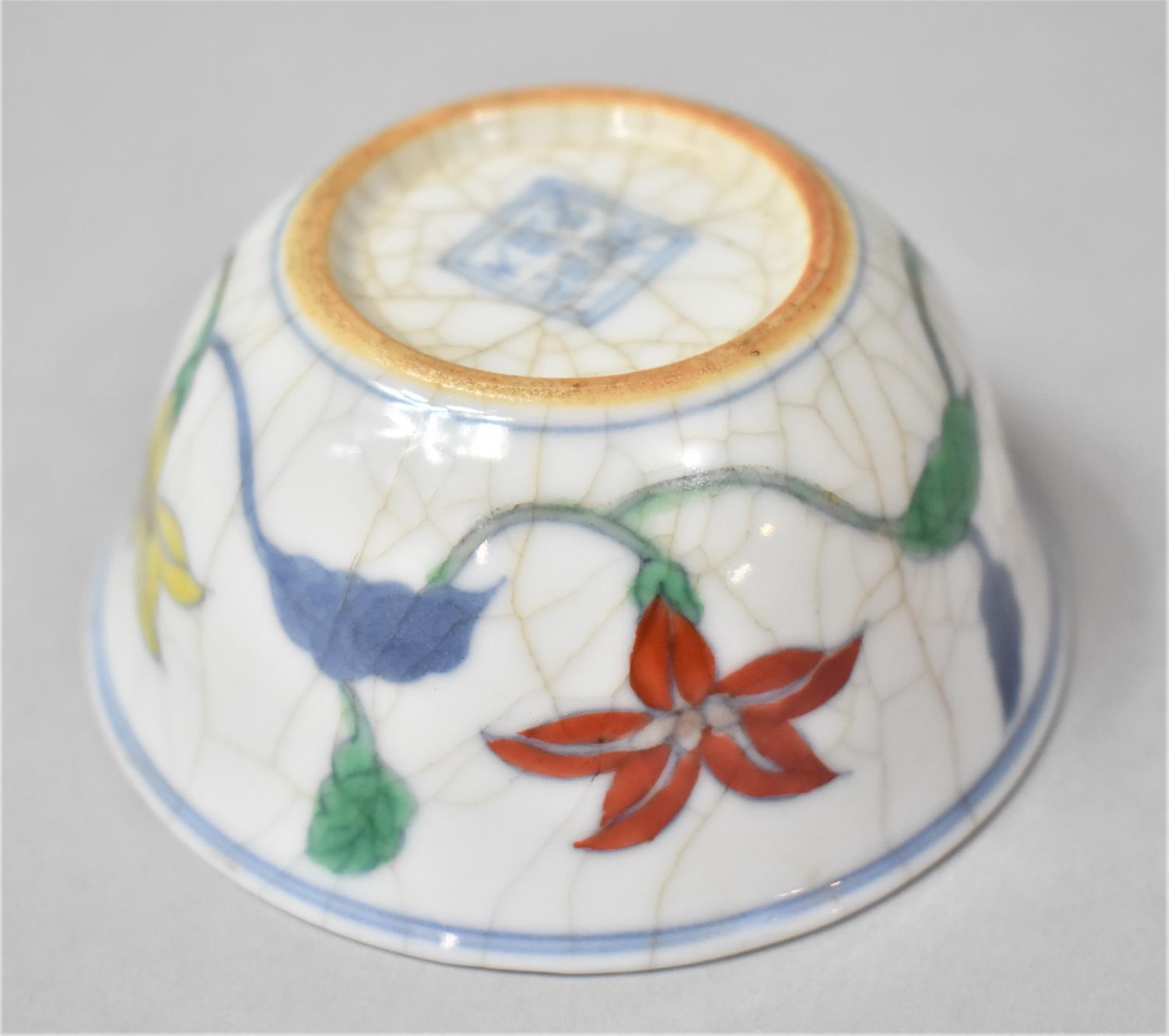 A Chinese Porcelain Crackle Glazed Wucai Teacup Decorated with Band of Flowers, Underglaze Six - Image 3 of 4