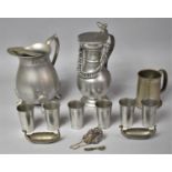 A Collection of Various Pewter Wares to comprise Pewter Tots, Ewer, Jug, Viking Ships, Tankards