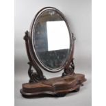 A Late Victorian Serpentine Front Oval Swing Dressing Table Mirror on Plinth Base with Jewel Well,