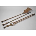 A Set of Long Handled Brass Fire Irons