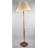 A Mid 20th Century Turned Wooden Standard Lamp and Shade