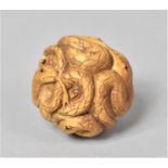 A Carved Wooden Netsuke of a Ball of Snakes with Glass Eyes