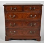 A Reproduction Cross Banded Mahogany Small Chest of Two Short and Three Long Drawers, 71cms Wide