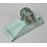 A Novelty Green Patinated Brass Doorstop in the Form of a Hedgehog, 16cm long