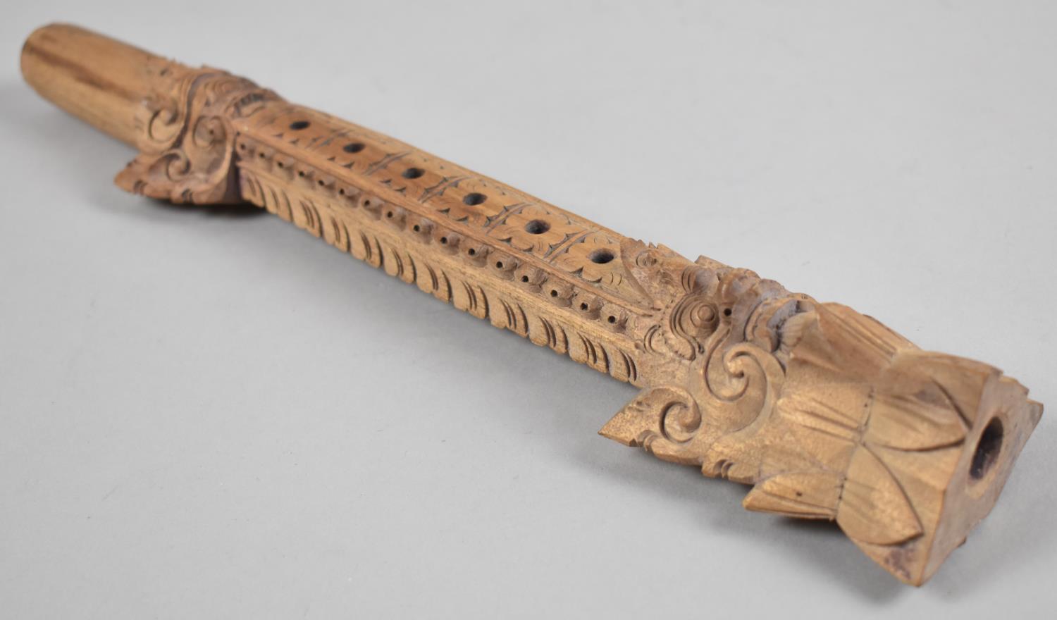 A Far Eastern Carved Wooden Musical Instrument, 33.5cms High