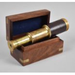 A Reproduction Miniature Leather Covered Brass Three Drawer Telescope