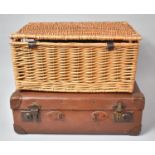 A Vintage Suitcase and Wicker Picnic Basket