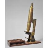 A Late 19th Century Lacquered Brass Compound Monocular Microscope with Japanned Metal Hinged