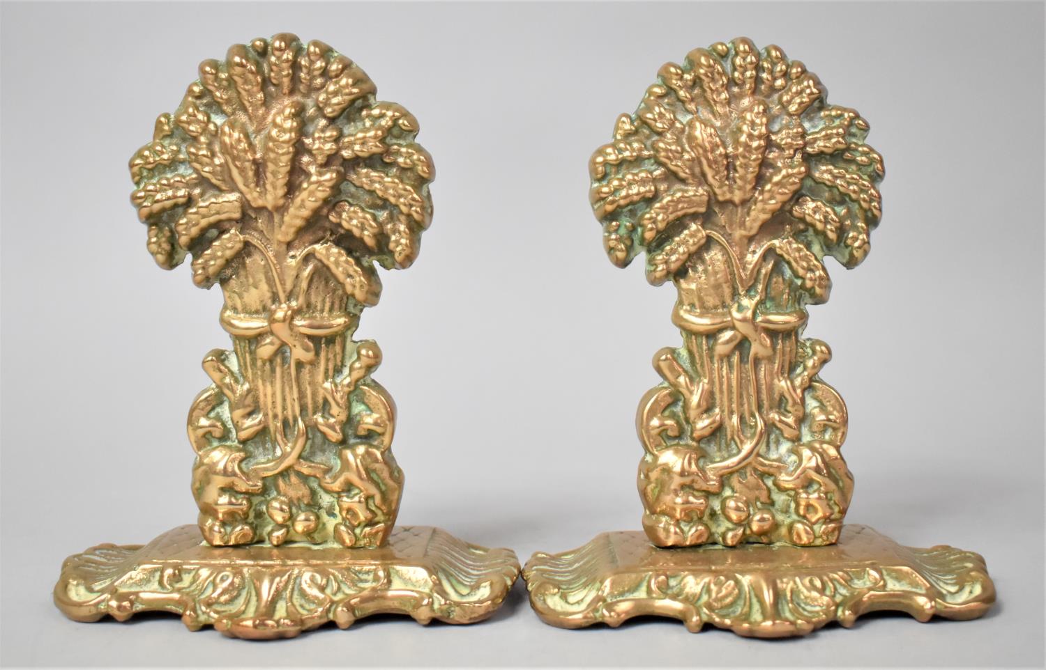 A Pair of Brass Wheatsheaf Fireside Ornaments, 16.5cms High