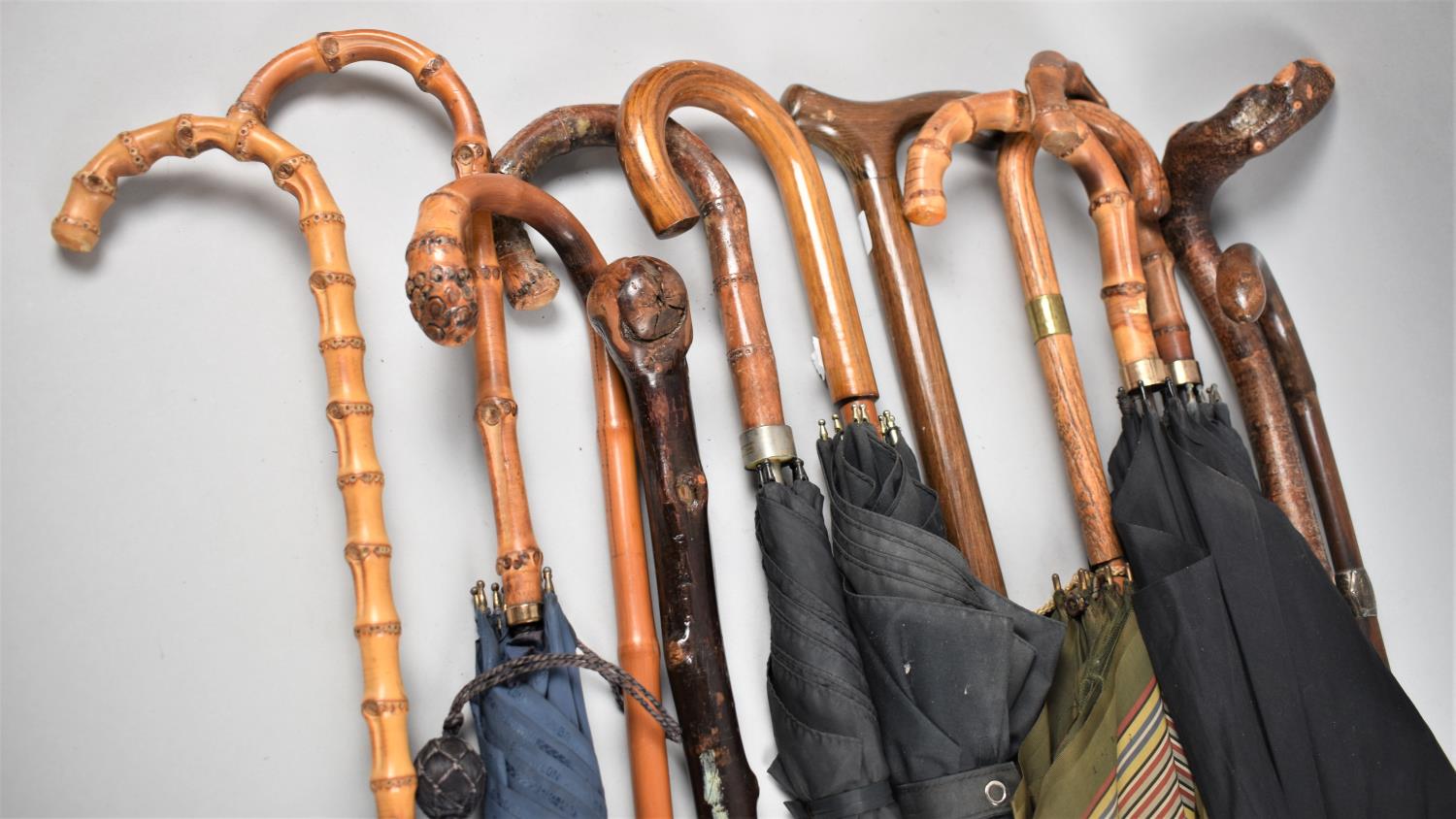 A Collection of Various Vintage Walking Sticks and Umbrellas, 12 in Total