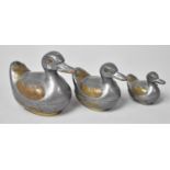 A Set of Three Chinese Graduated Pewter and Brass Novelty Trinket Boxes in the Form of Ducks,