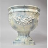 A Modern Ceramic Jardiniere with Relief Floral Decoration to Body and Square Plinth Base, 31cm