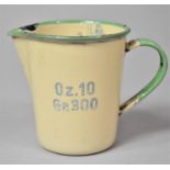 An Early 20th Century Swedish Enamelled Measuring Jug by Kockums, 10cm high