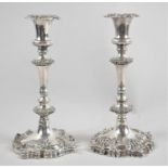 A Pair of Weighted Silver Plated Rococo Style Candlesticks, 25cms High