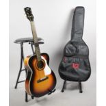 A Stella Harmony Acoustic Guitar, Kinsman Guitar Stand/Stool, Guitar Stand and a Carrying Bag