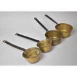 A Collection of Four Graduated Brass Saucepans with Iron Handles, The Largest 15cms Diameter
