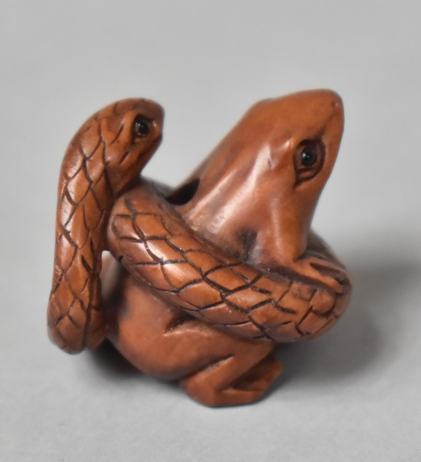 A Carved Wooden Netsuke in the form of a Snake Entwining a Frog - Image 4 of 4