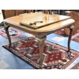 An Early 20th Century Walnut Wind Out Dining Table with One Extra Leaf, on Cabriole Supports with