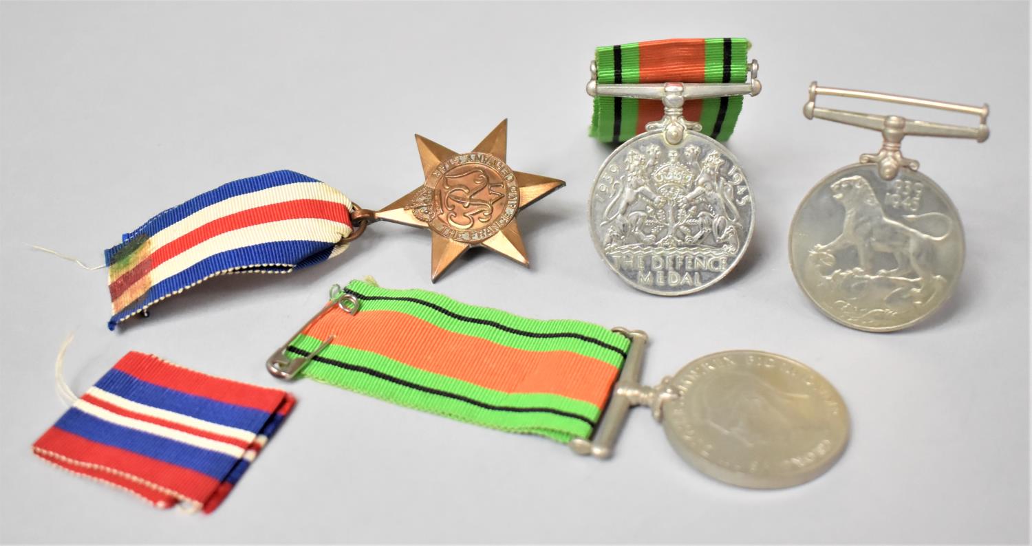 A Collection of Four WWII Medals to Include 1939-1945, The Defence Medal x2 and The France and