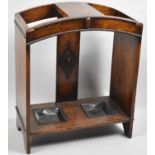 An Edwardian Oak Two Section Stick Stand with Metal Drip Trays and Arched Top, 51cm wide