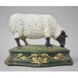 A Reproduction Cast Metal Novelty Doorstop in the Form of a Black Faced Sheep Grazing, 26cm wide