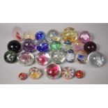 A Collection of Various Glass Paperweights