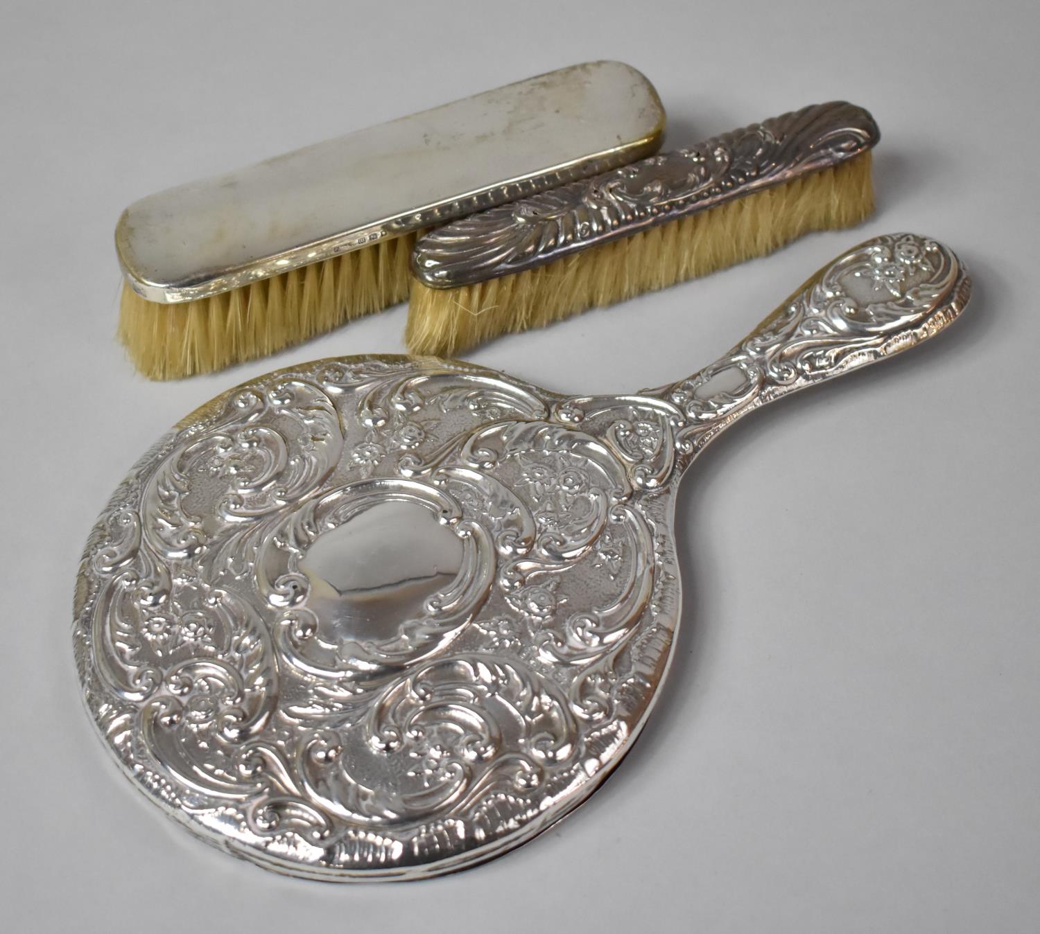 A Collection of Three Silver Mounted Dressing Table Items to Include Two Brushes and a Mirror (Glass