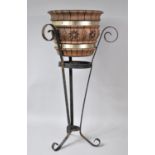 A Modern Wrought Iron Plant Stand with Unrelated Carved Wooden Jardiniere