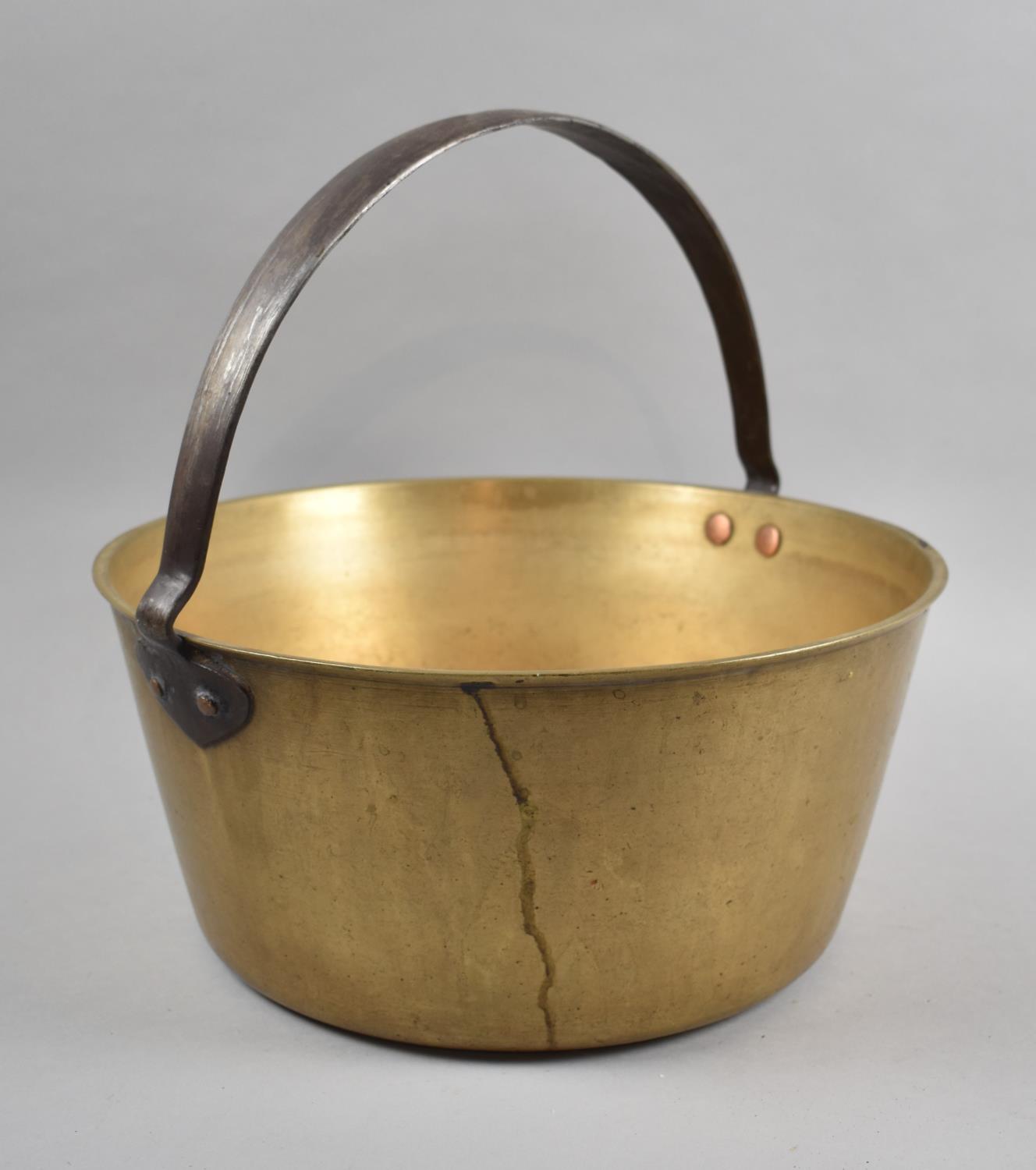 A Large Vintage Brass Jam Kettle with Iron Loop Handle, 32cm Diameter