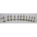 A Set of Eleven Britains Lead Footballers, the Bases Stamped Copyright 1904, Pale Blue Shirts, White