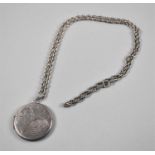 A Circular Silver Photo Locket on Chain