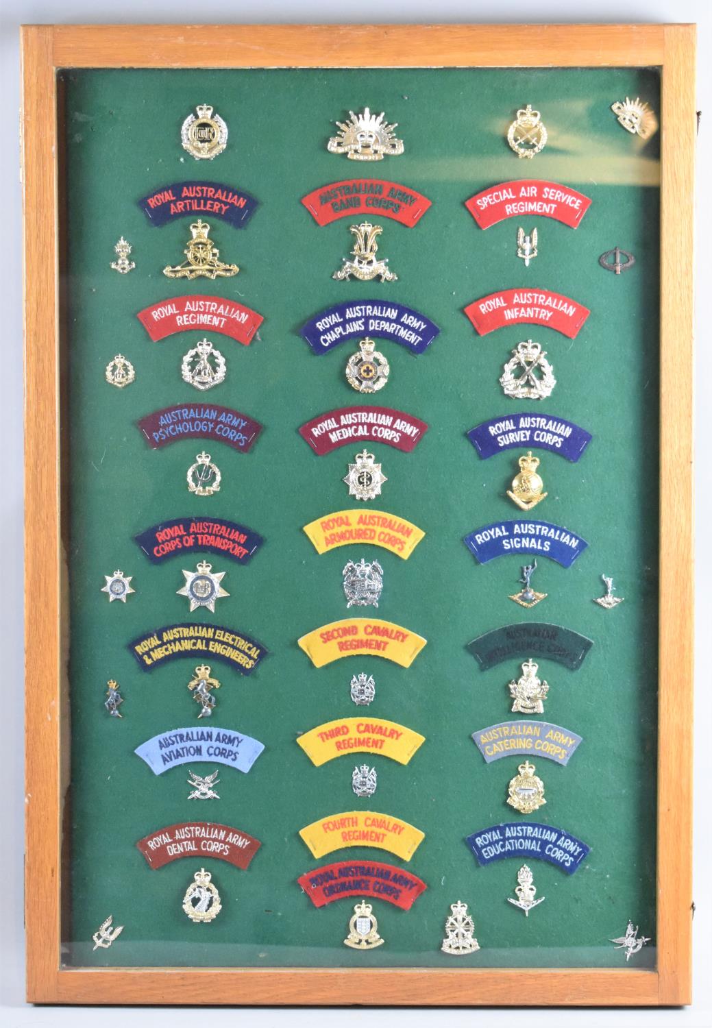 A Framed Panel Displaying Royal Australian Military Badges, Cloth Regimental Badges, 56x82cm Overal