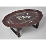 An Oriental Mother of Pearl Inlaid Oval Table Decorated with Birds and Flowers, 51cm wide and 18cm