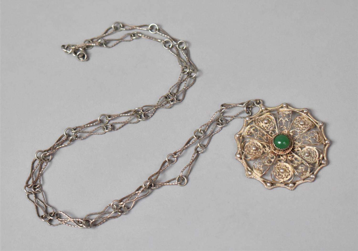 A Silver Filigree Pendant on 60cm Silver Chain