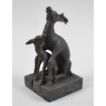 A Novelty Chinese Patinated Bronze Seal in the Form of Mating Deer, 12cm high