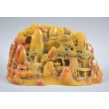 A Faux Soapstone Chinese Moulding Depicting Mountain Village with Trees and Figures, 22cm wide