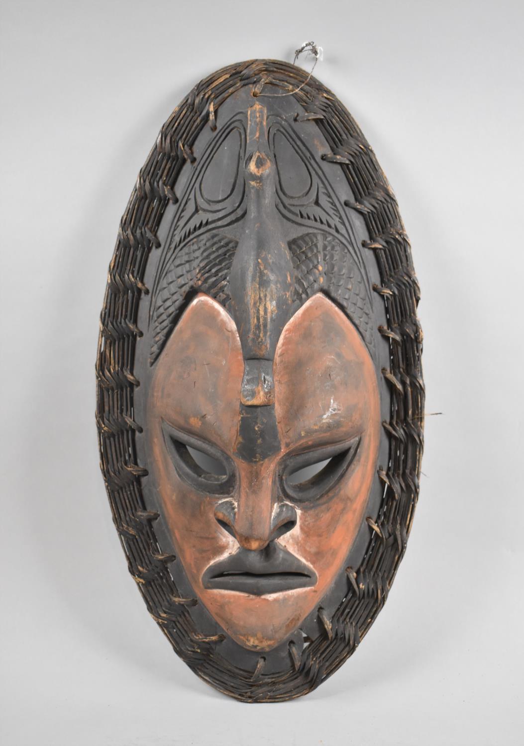 A Vintage Carved Wooden Spirit Mask with Woven Border, 55cm High