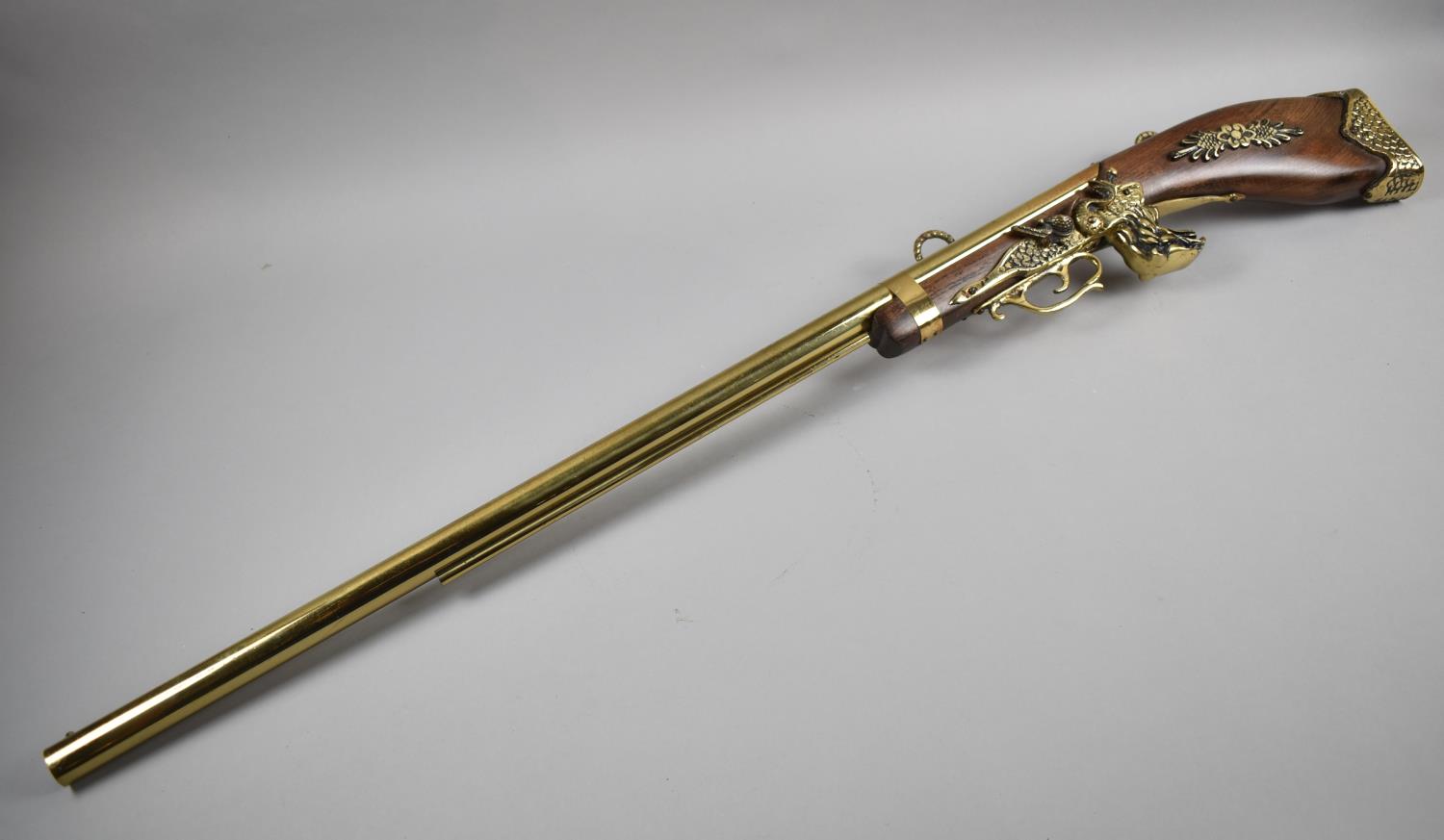 A Mid 20th Century Reproduction Brass Mounted Wall Hanging Flintlock Rifle, 107cm long