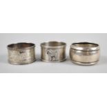 A Collection of Three Silver Napkin Rings, One Example Decorated in Relief with Airedale Terrier,