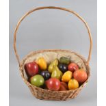 An Oval Wicker Basket Containing Artificial Fruit, 40cm wide