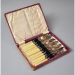 A Cased Set of Six Bone Handled Fish Knives and Forks with Silver Collars