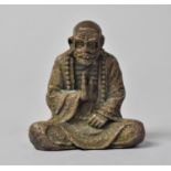 A Bronze Study of a Seated Monk, 4.5cm high