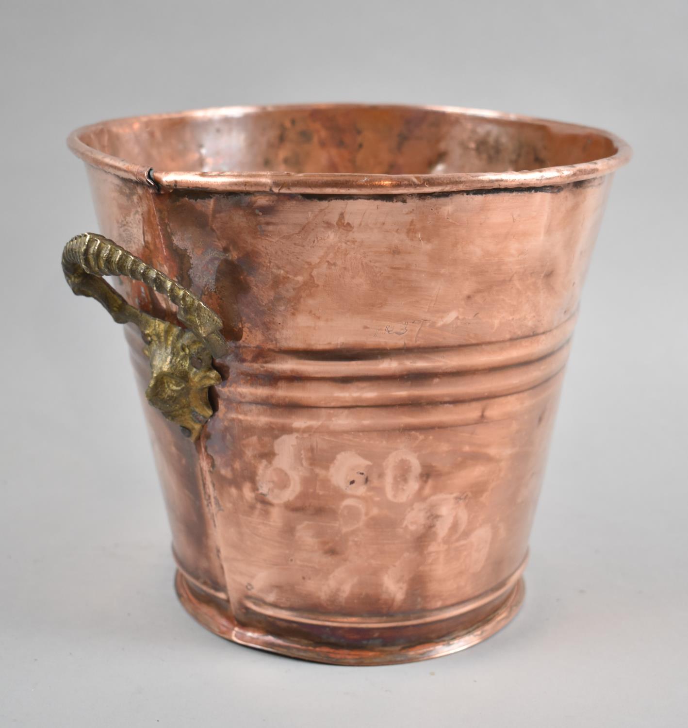 A Reproduction Copper Wine Cooler with Brass Mask Handles, 23cm Diameter and 21cm high