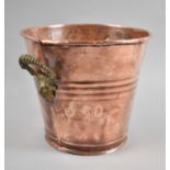 A Reproduction Copper Wine Cooler with Brass Mask Handles, 23cm Diameter and 21cm high