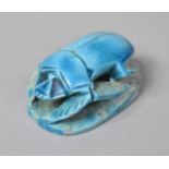 An Egyptian Souvenir in the Form of a Blue Glazed Scarab Seal, 4.5cm long