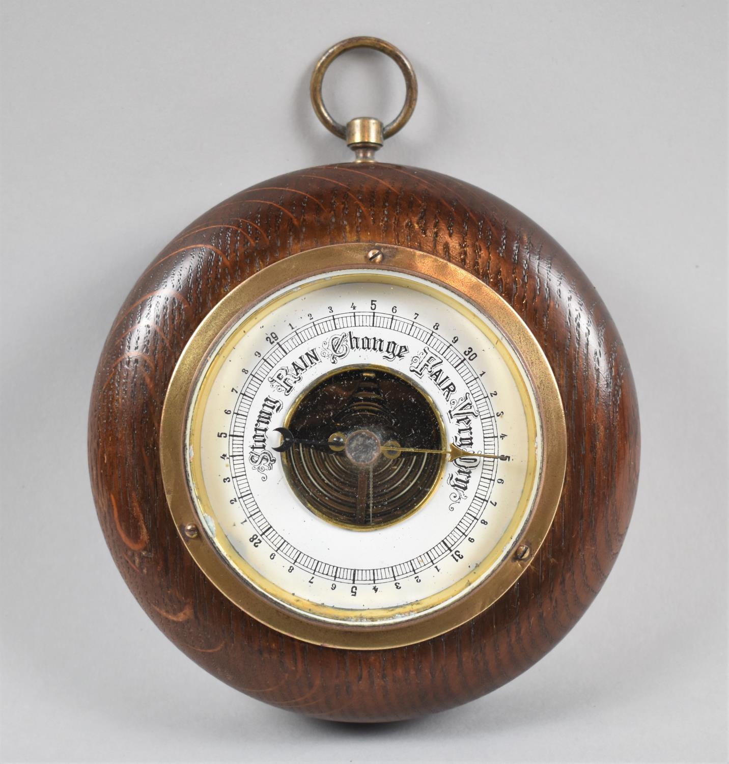 An Edwardian Circular Oak Aneroid Barometer, 13.5cm Diameter