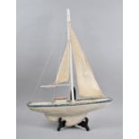 A Folk Art Painted Wooden Model of a Sailing Yacht, 41cm Long