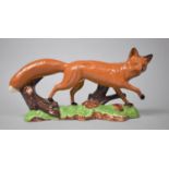 A Glazed Figure of Running Fox, 29cm Long