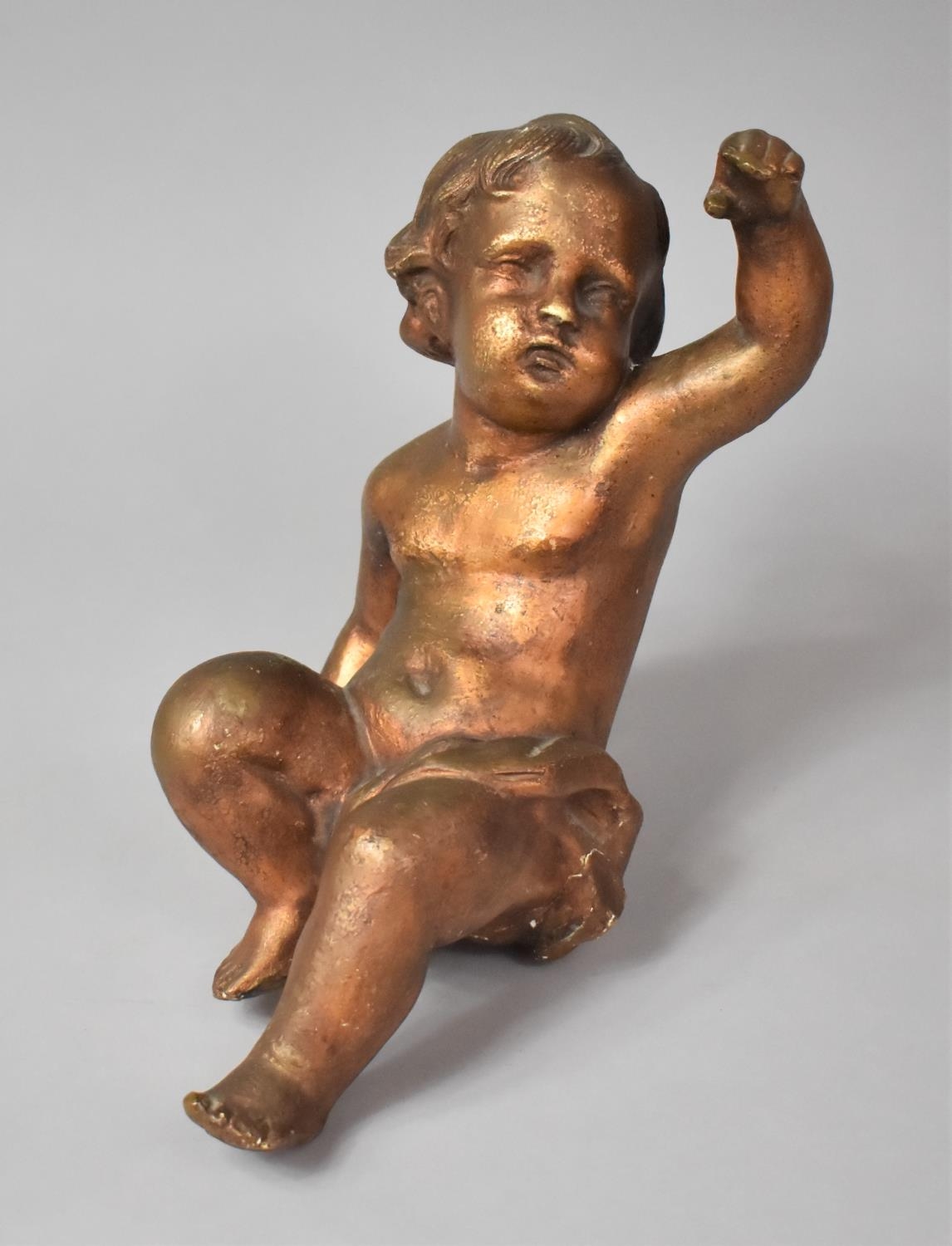 An Early 20th Century Continental Putti, Gilded Cast Composition Material. 12cm x 15cm x 30cm. AF