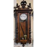 A Late Victorian Walnut Two Weight Vienna Wall Clock with Eagle Finial